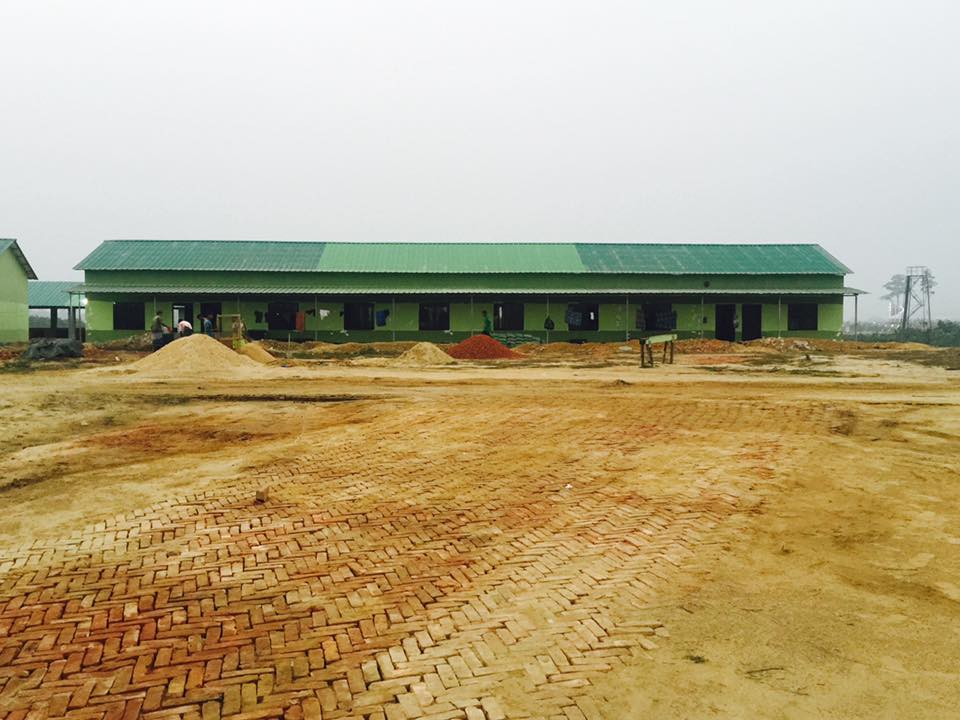 Barrack building with brick paved ground under construction